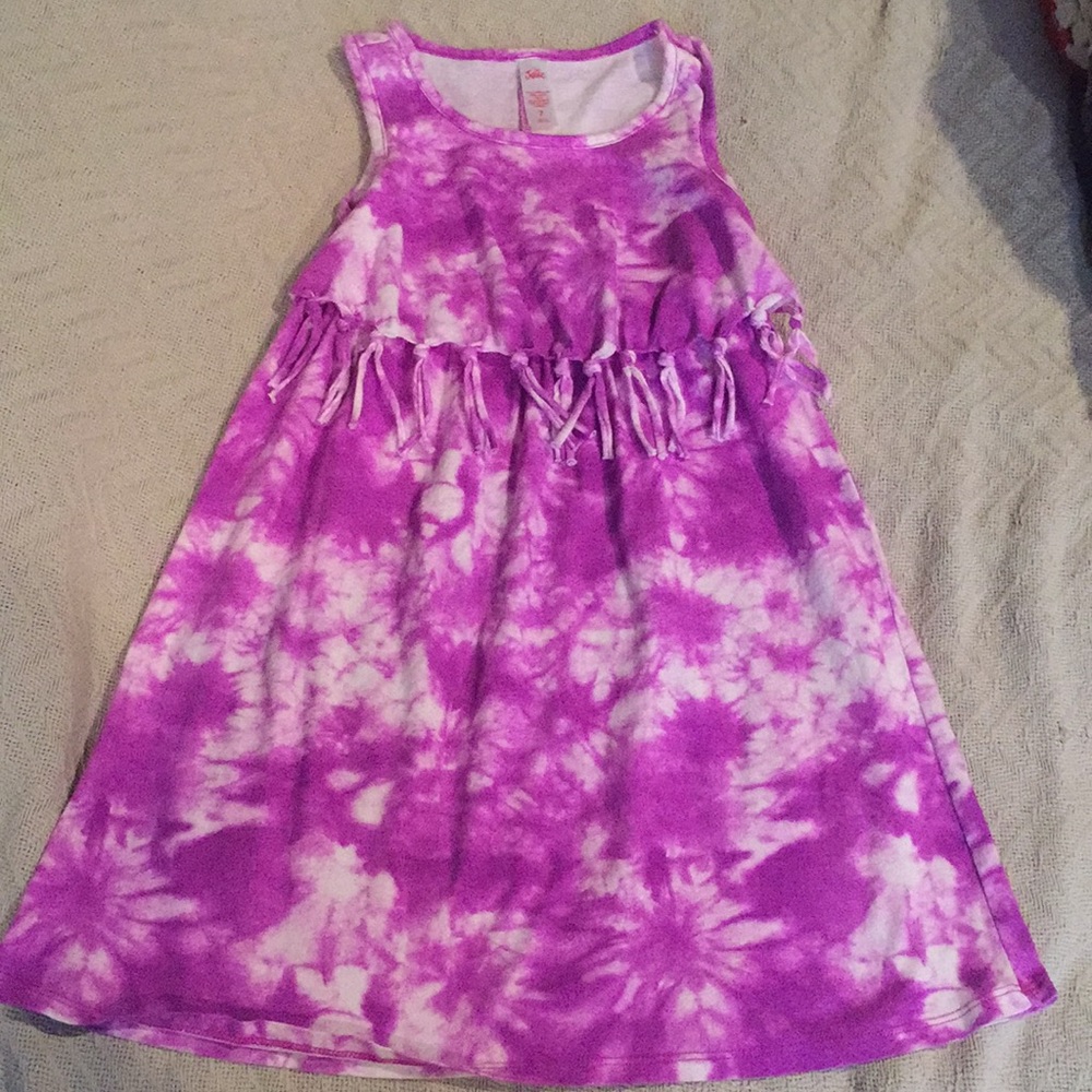 Tie dyed girl’s dress with fringe on bottom of top